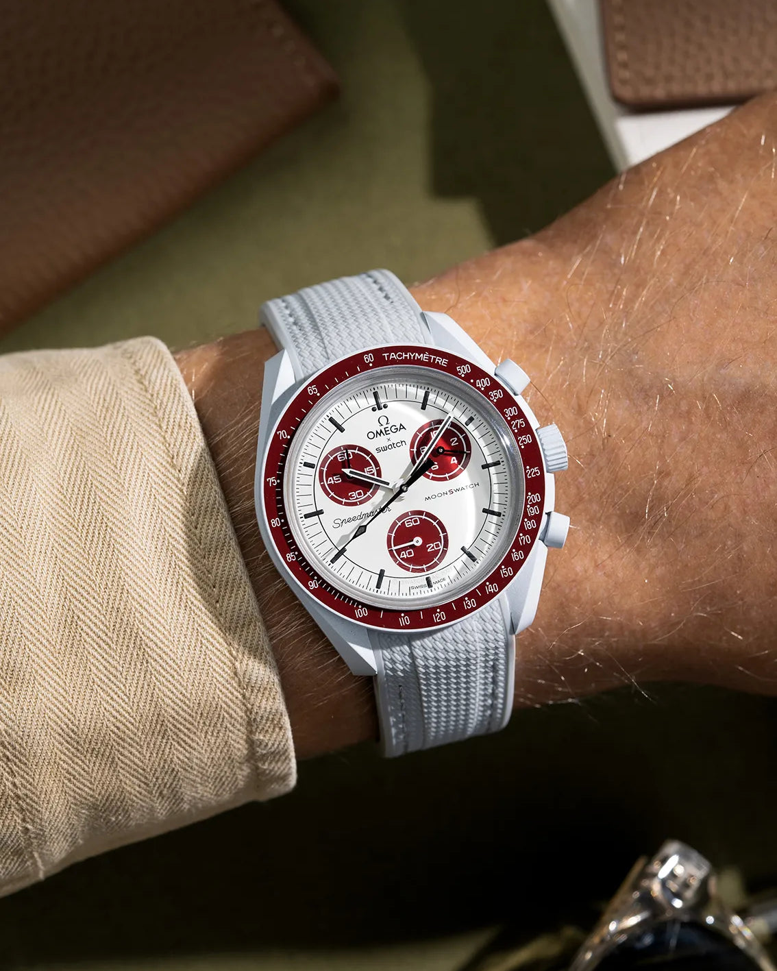Curved Vertech rubber strap for MoonSwatch Mission to Pluto – grey strap wrist shot