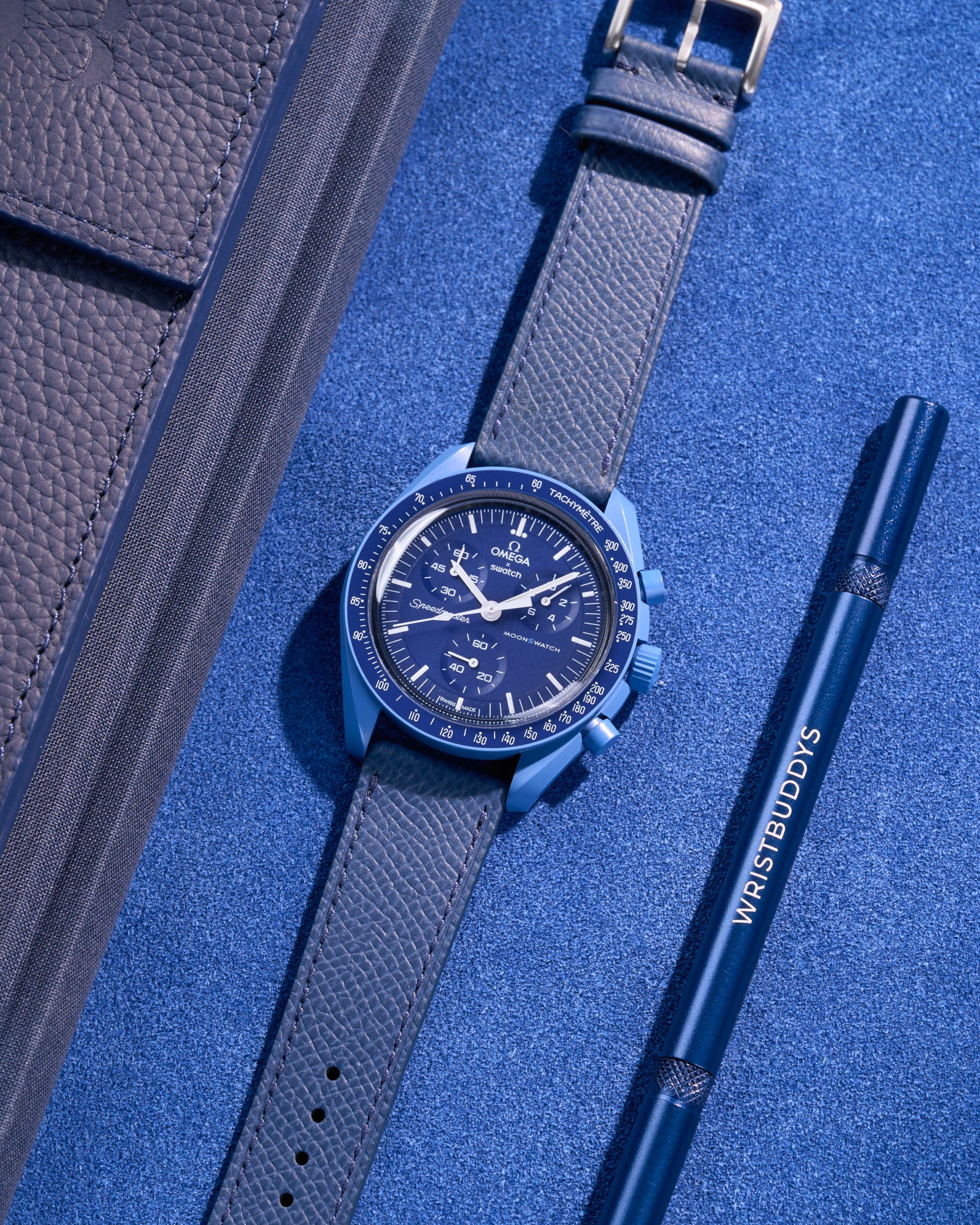 Flat lay of Navy Blue Epsom leather strap for Omega x Swatch MoonSwatch Neptune