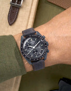 Wrist shot of Omega X Swatch Mission to Mercury with Dark Grey & Orange Stitch Denim Strap – denim texture detail