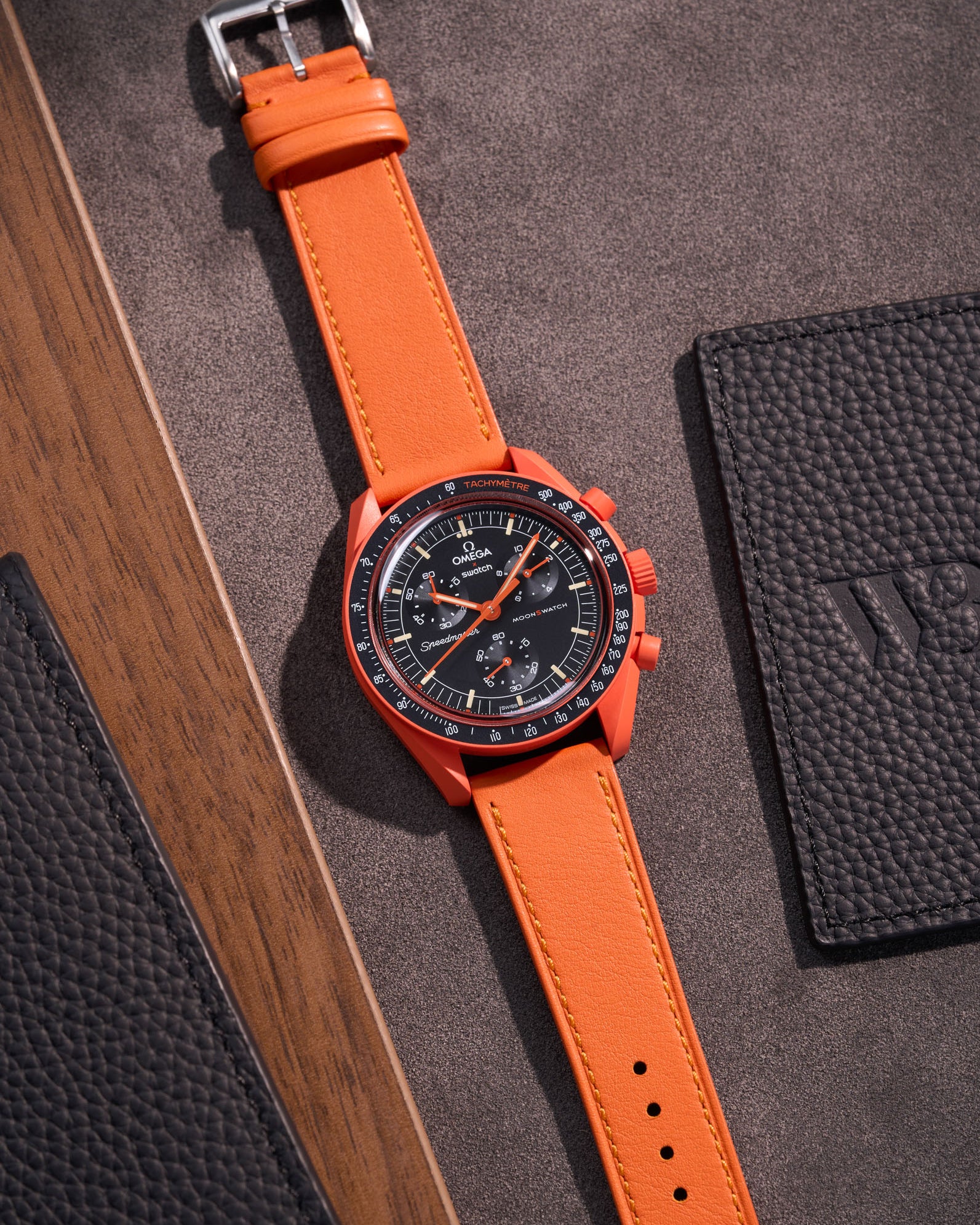 Flat lay of Orange Cowhide leather strap for Omega x Swatch MoonSwatch mission on Earth Lava