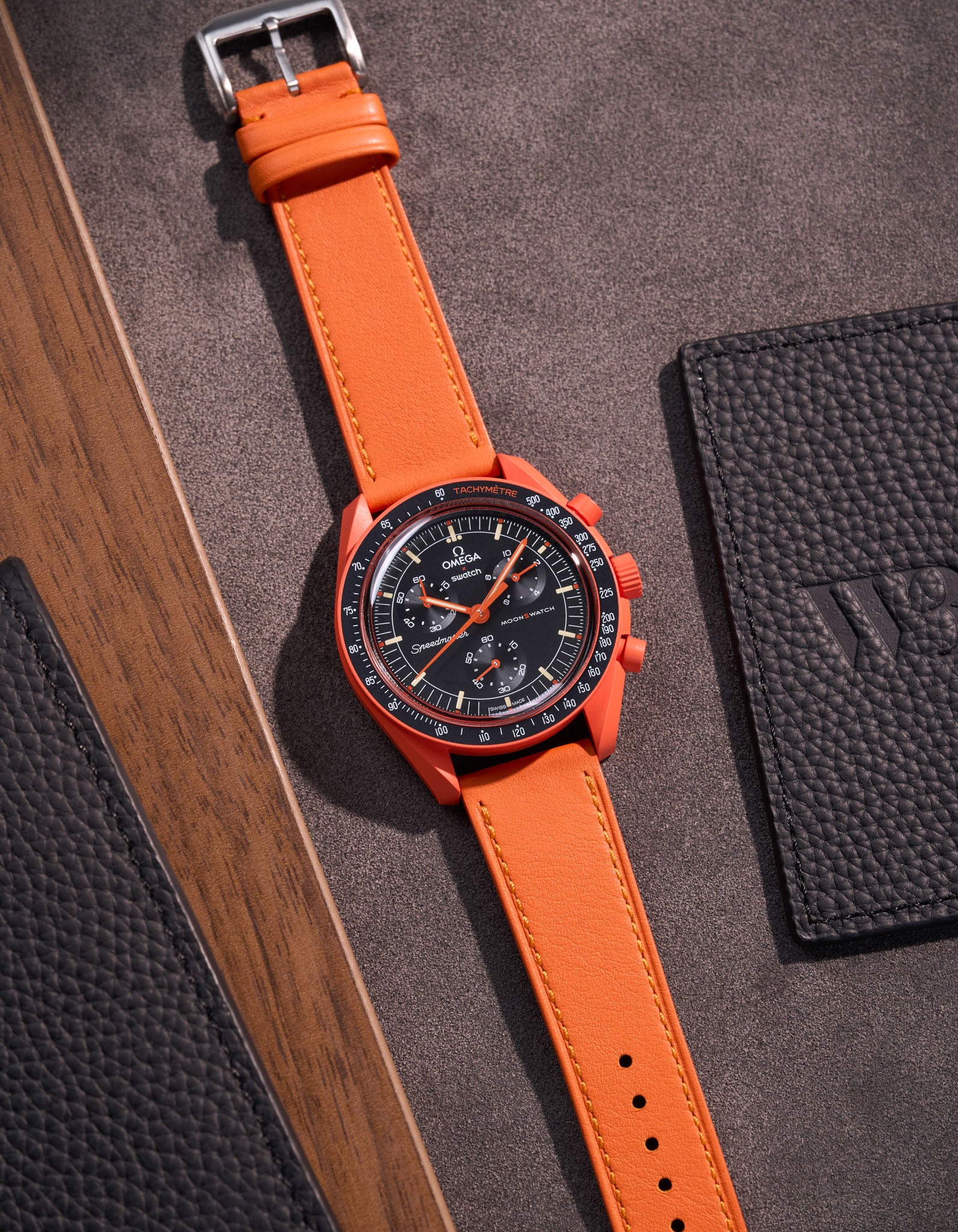 Flat lay of Orange Cowhide leather strap for Omega x Swatch MoonSwatch mission on Earth Lava