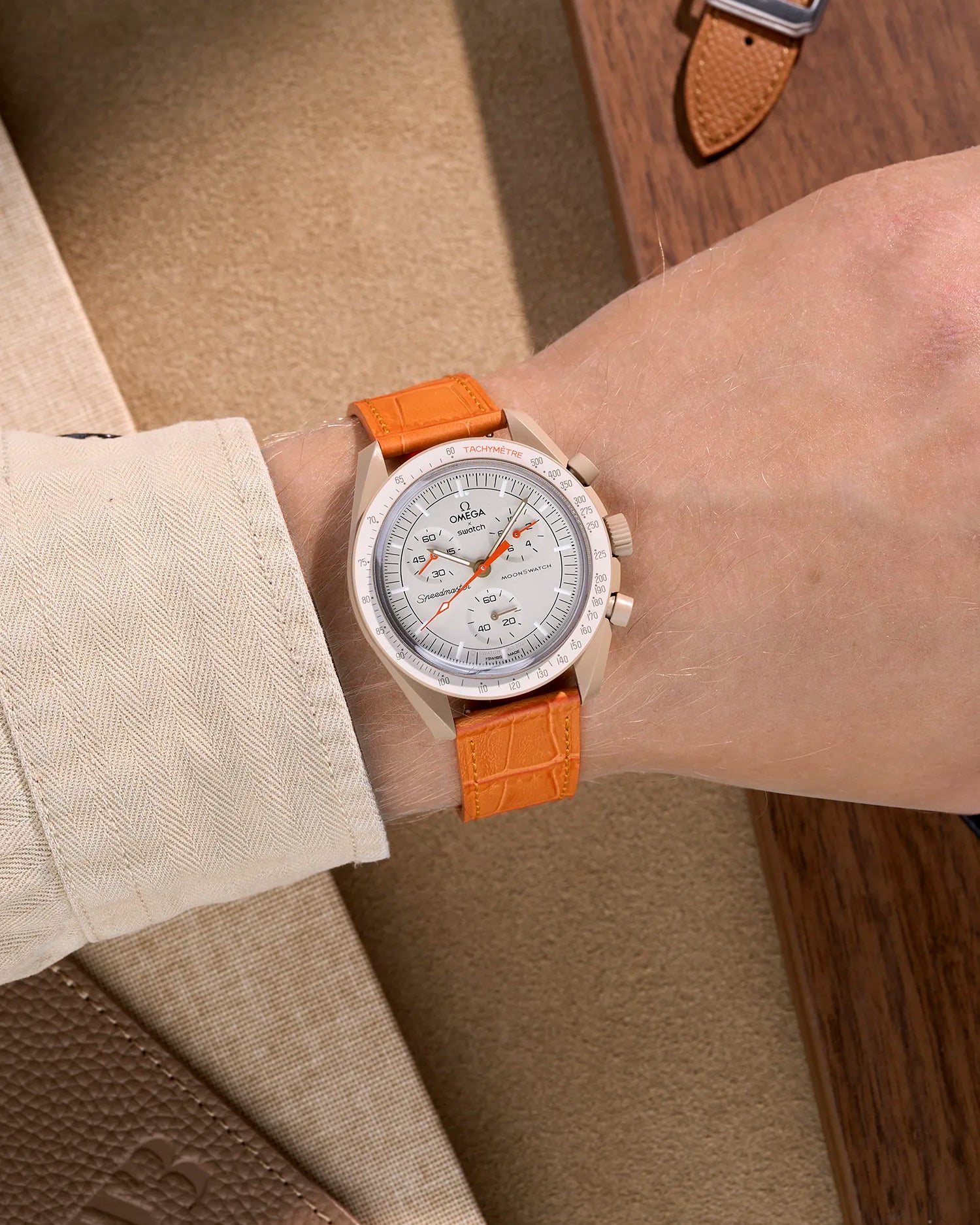 Orange embossed alligator leather strap on Omega X Swatch MoonSwatch Mission to Jupiter – wrist shot