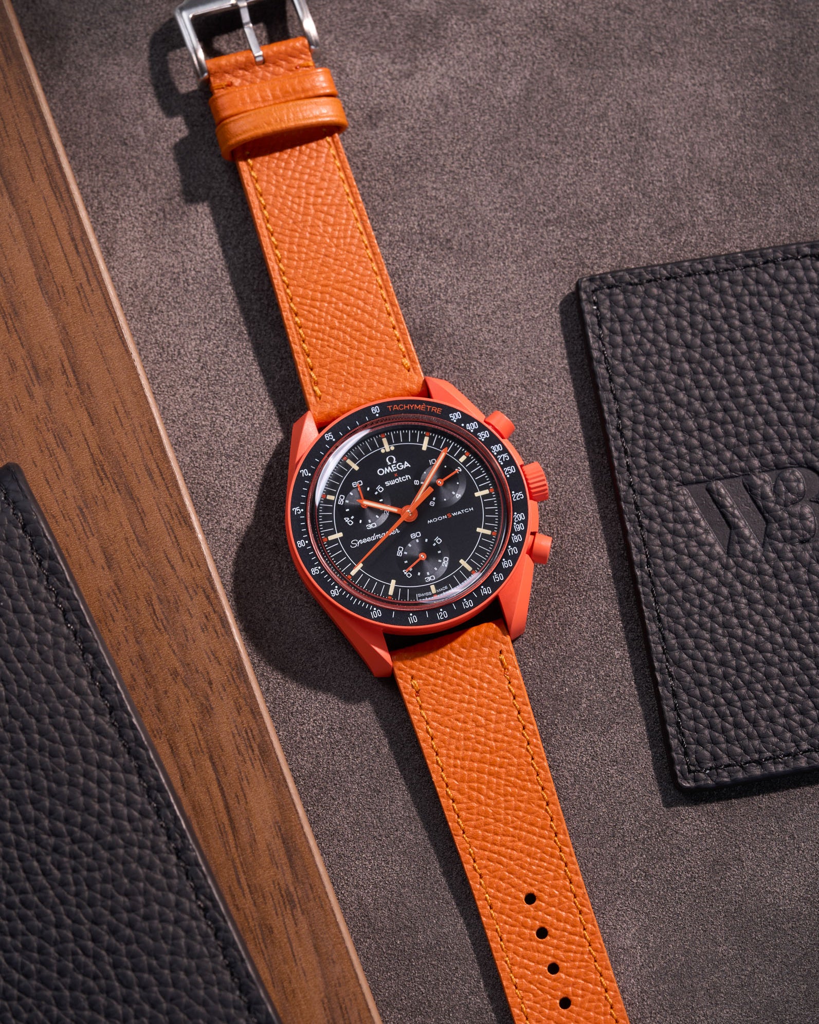 Flat lay of Orange Epsom leather strap for Omega x Swatch MoonSwatch mission on Earth Lava