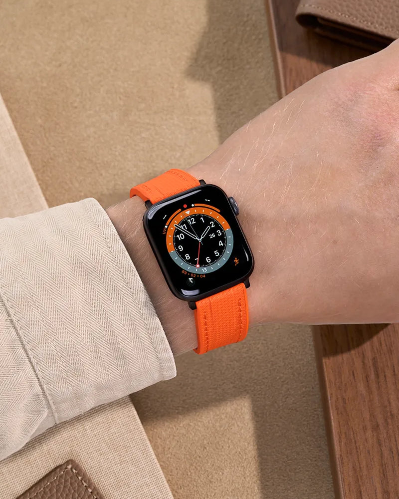 Orange Rubber Apple Watch Band worn on wrist