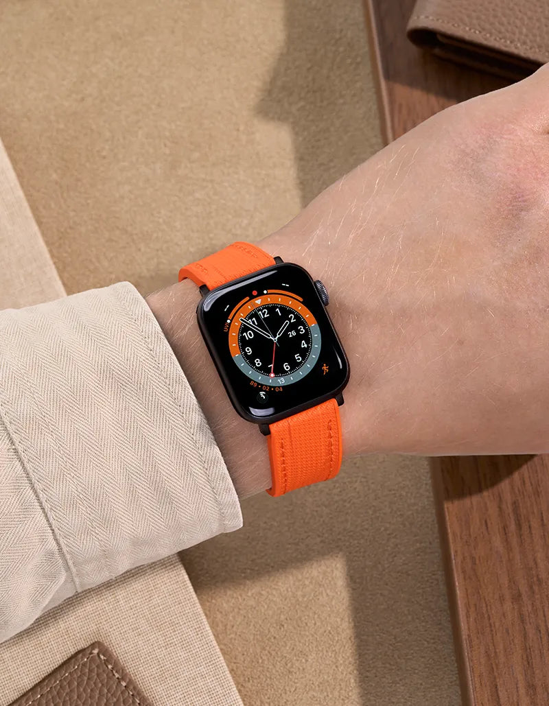 Orange Rubber Apple Watch Band worn on wrist