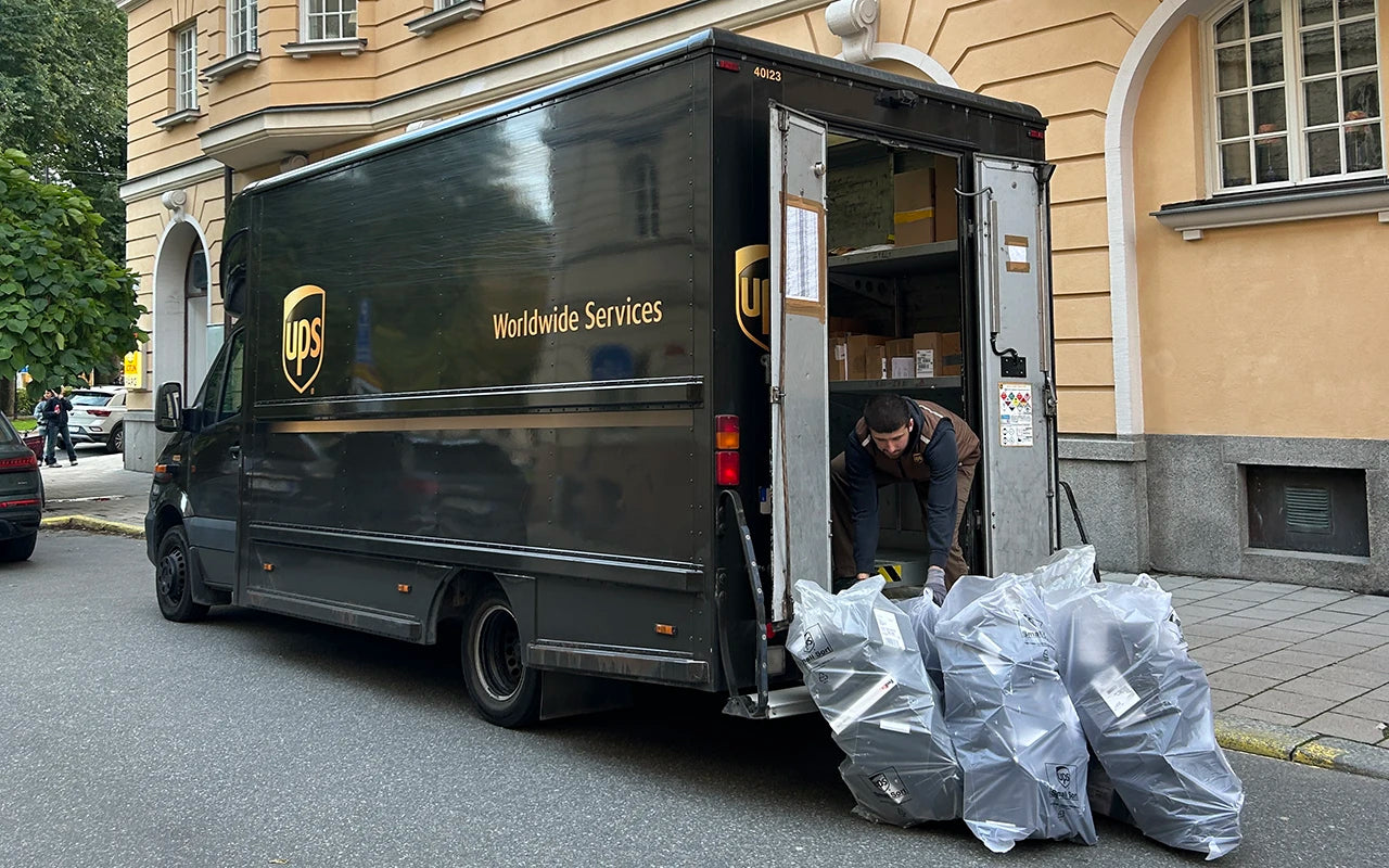 UPS truck loading Wristbuddys rubber strap shipments from Stockholm warehouse for global delivery to customers