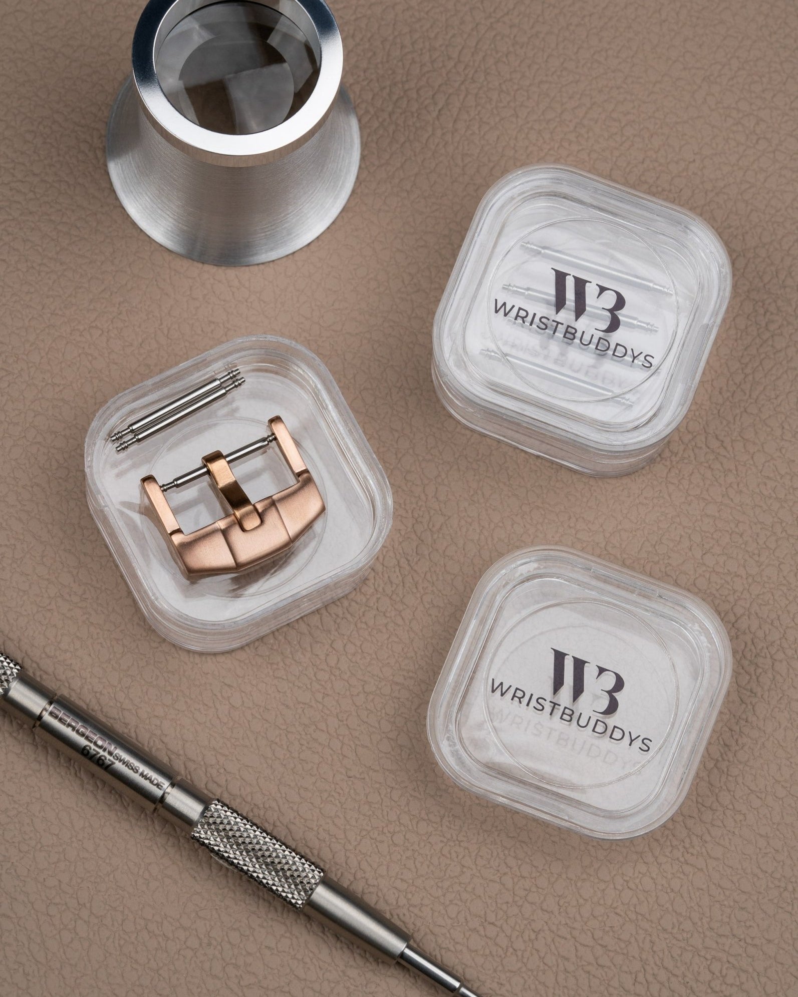 Premium Buckle in Rose Gold with spring bars and spring bar tools beside