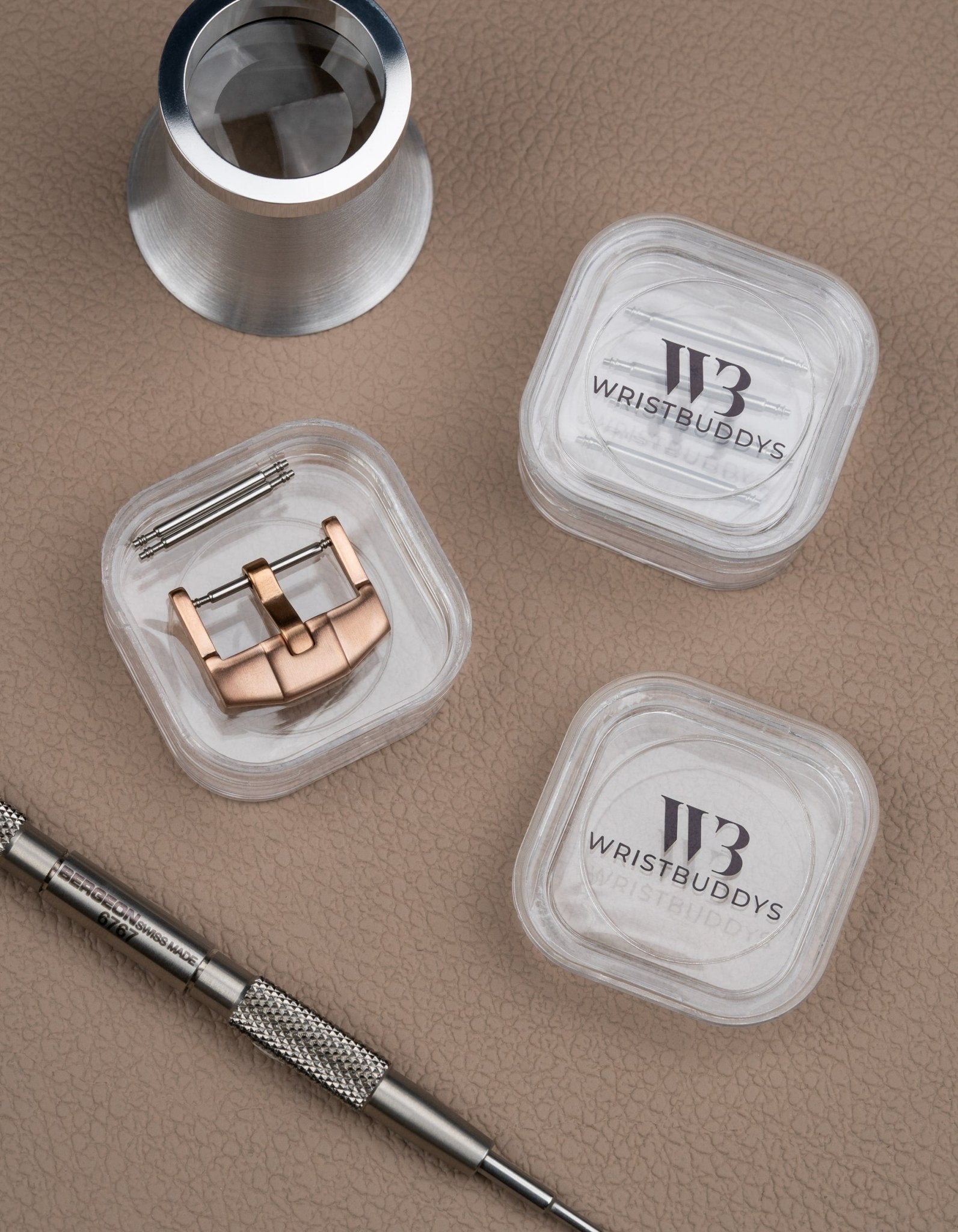 Premium Buckle in Rose Gold with spring bars and spring bar tools beside