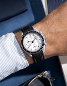 Black vurved vertech rubber strap with white stitches mounted on Omega X Swatch MoonSwatch 1965 model – shown on wrist