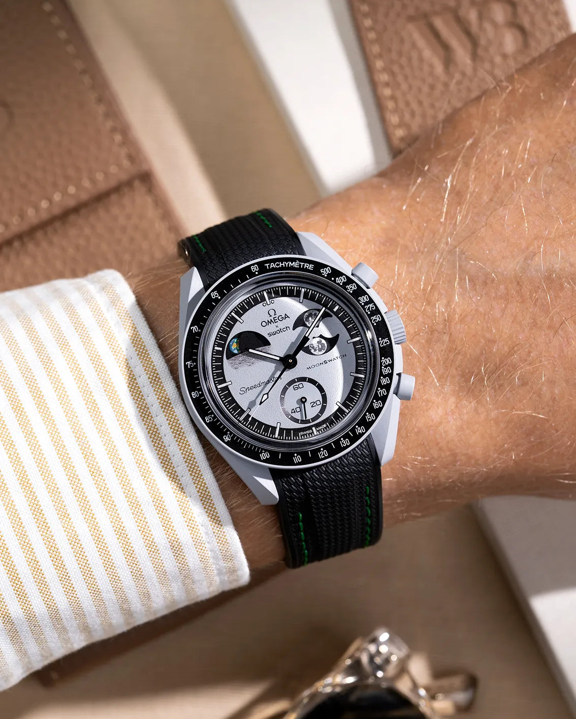 Black curved vertech rubber strap with green stitching for MoonSwatch – wrist shot on Mission to the EarthPhase