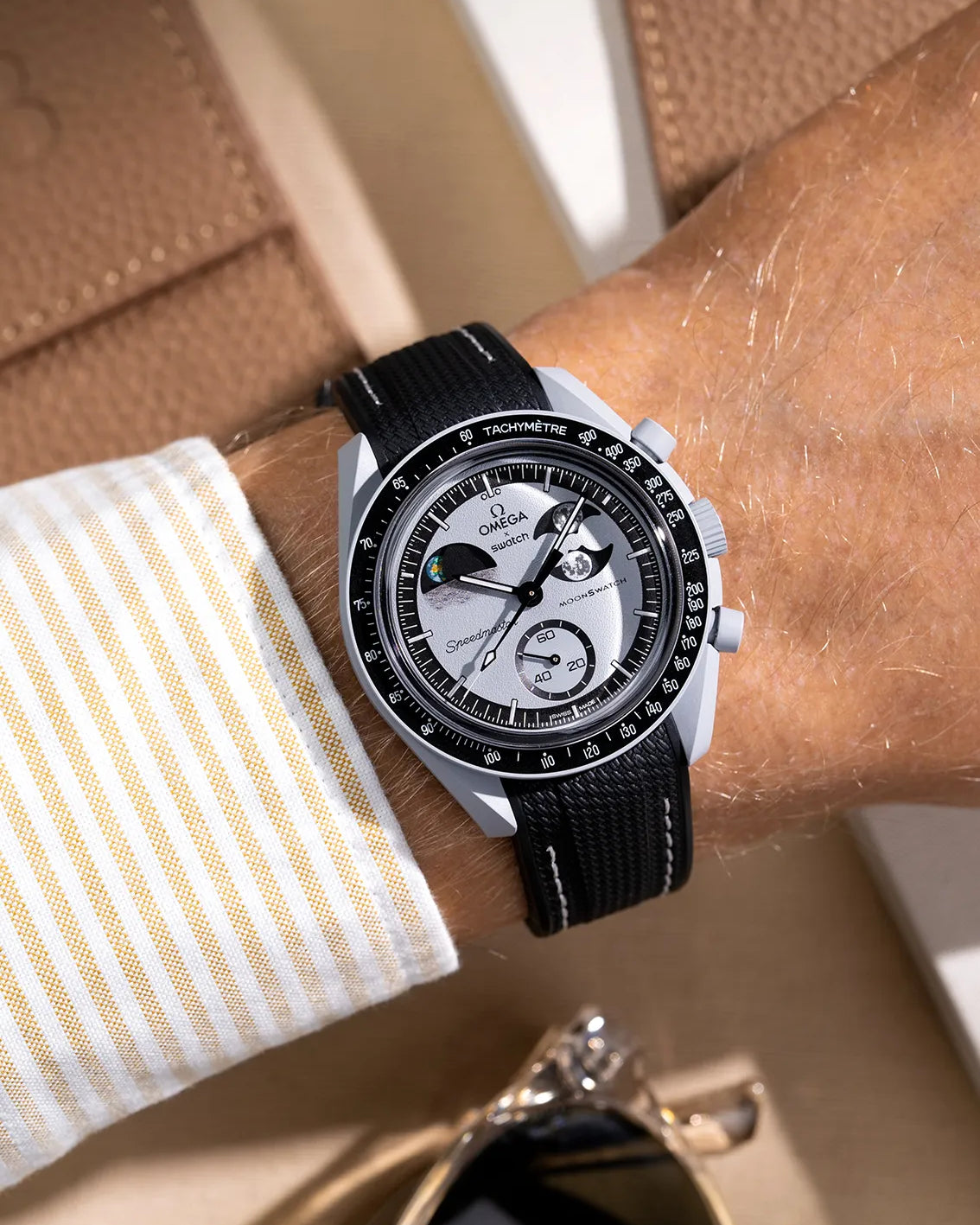 Black curved vertech rubber strap with white stitching for MoonSwatch – wrist shot on Mission to the EarthPhase