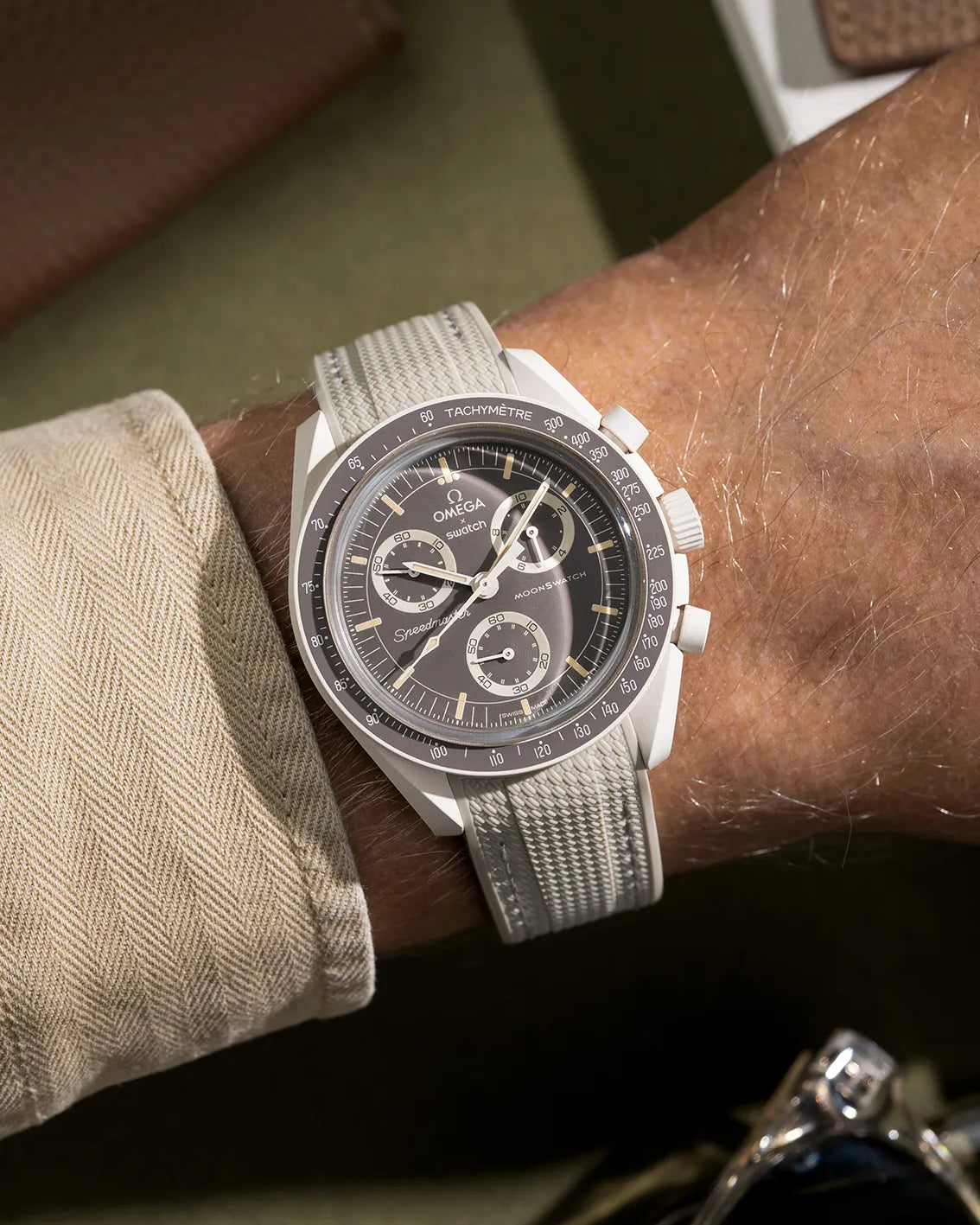 Rubber strap for MoonSwatch Mission on Earth Desert – beige curved-end band shown on watch