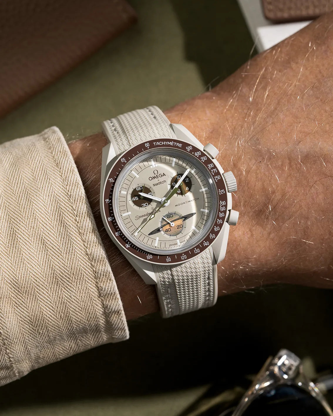 Curved Vertech rubber strap for MoonSwatch Mission to Saturn – beige strap wrist shot