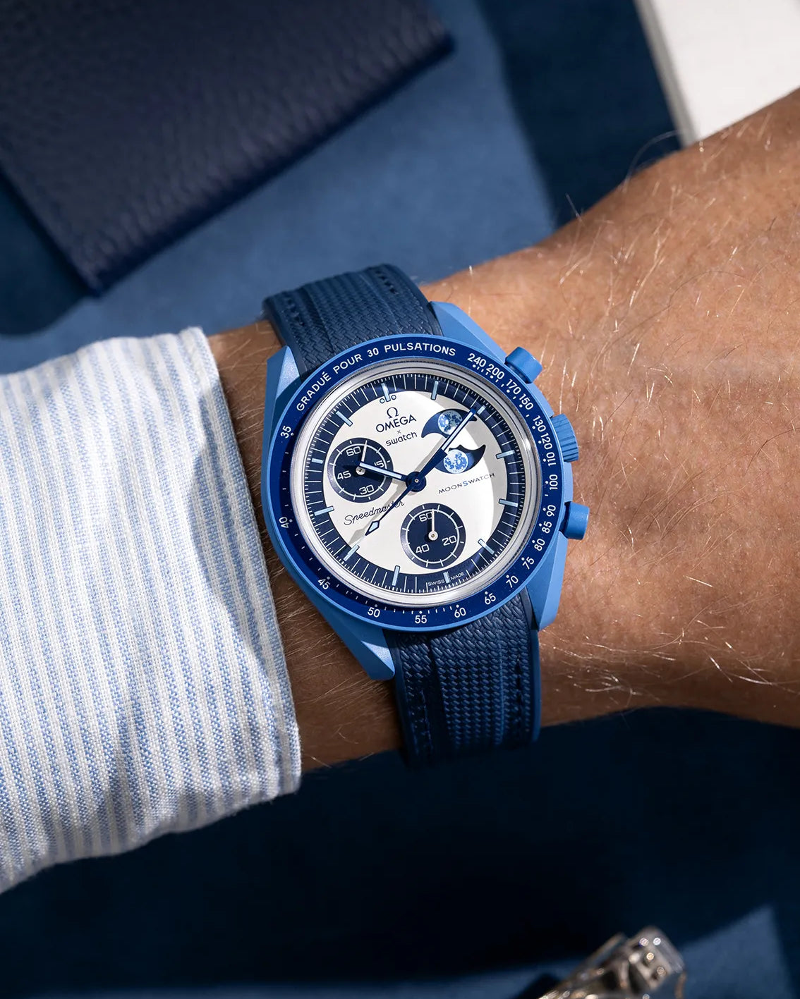Wrist shot of blue rubber strap for MoonSwatch, photographed on the Mission to the Super Blue Moonphase