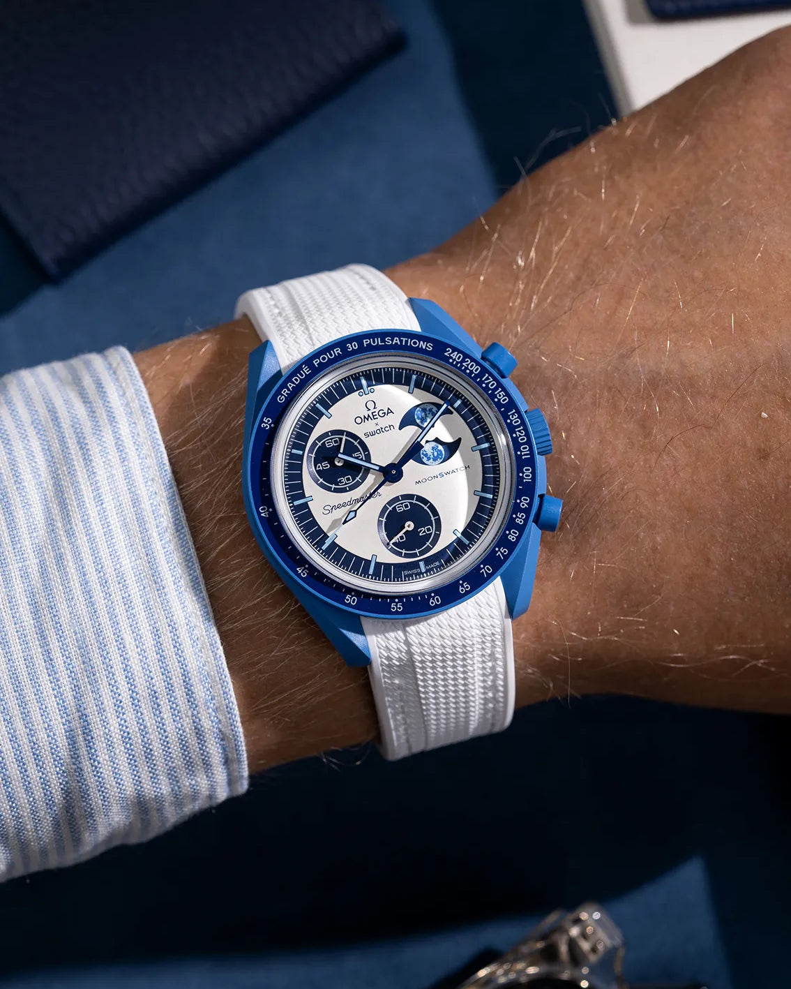 Wrist shot of white rubber strap for MoonSwatch, photographed on the Mission to the Super Blue Moonphase