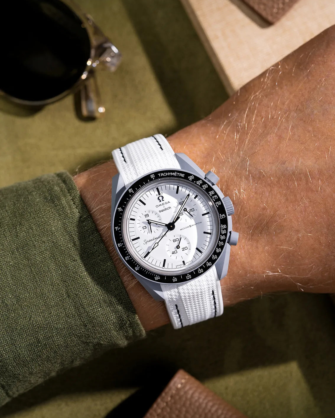 Curved white rubber strap with black stitches on Omega X Swatch MoonSwatch Mission to 1965 – photographed on wrist