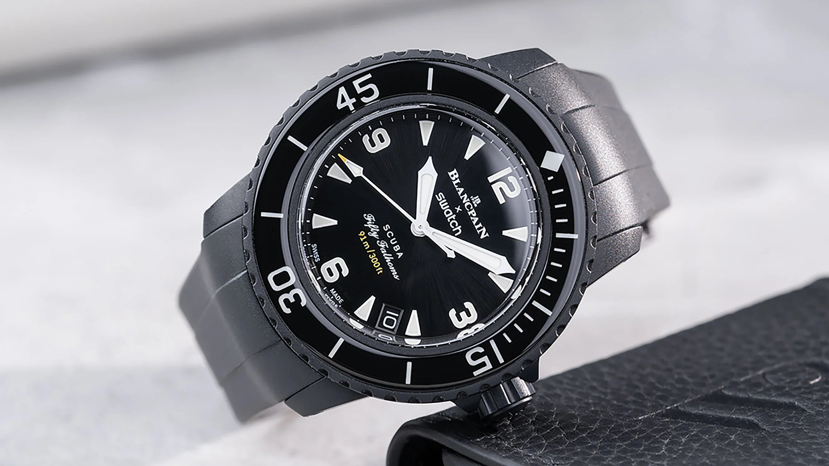 Straps for Blancpain X Swatch watches shown on Fifty Fathoms model with rubber strap