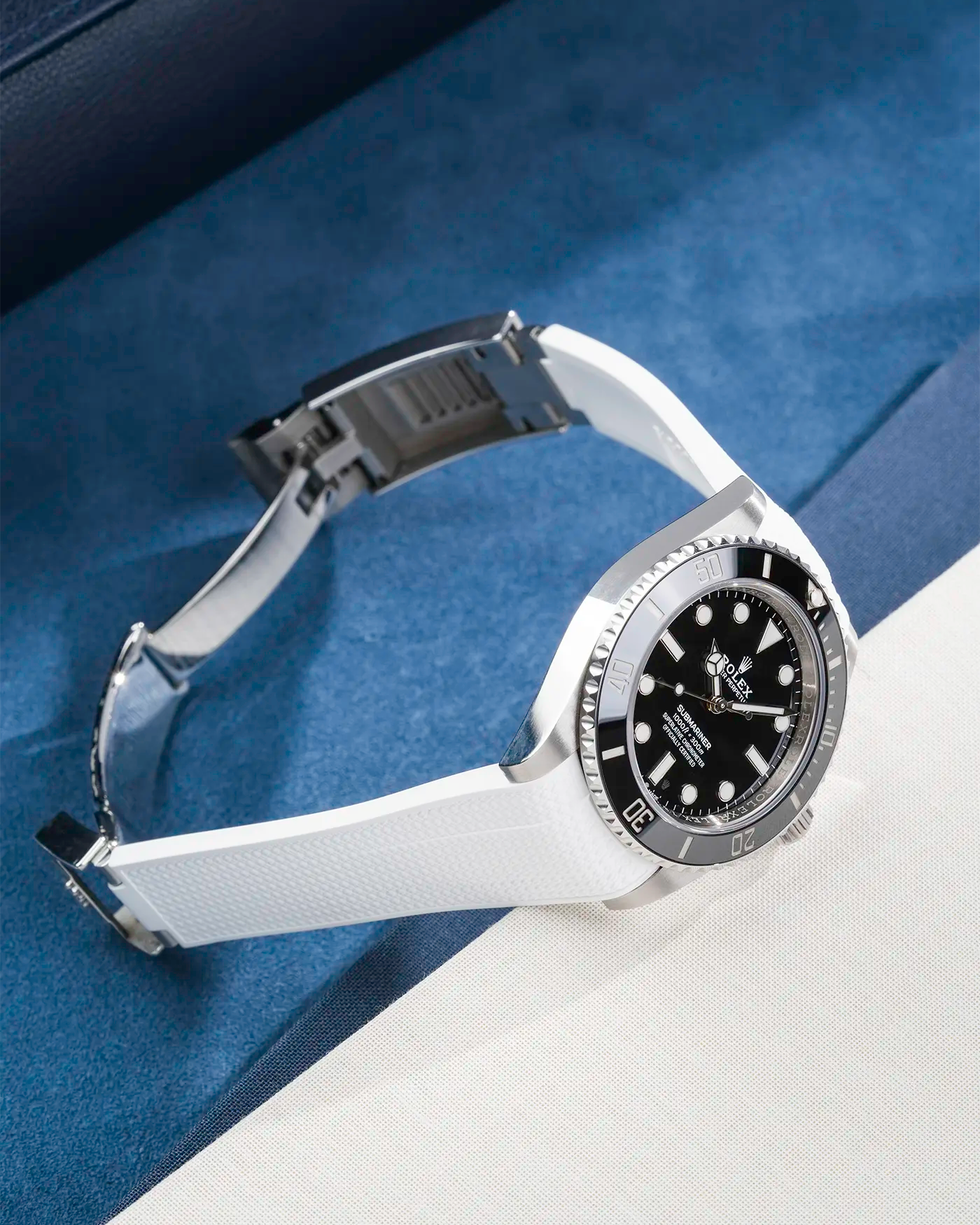 Rolex Submariner 41 with white Vertech FKM Rubber Strap sitting on the watch, integrated with original clasp – product photo side angle with clasp open