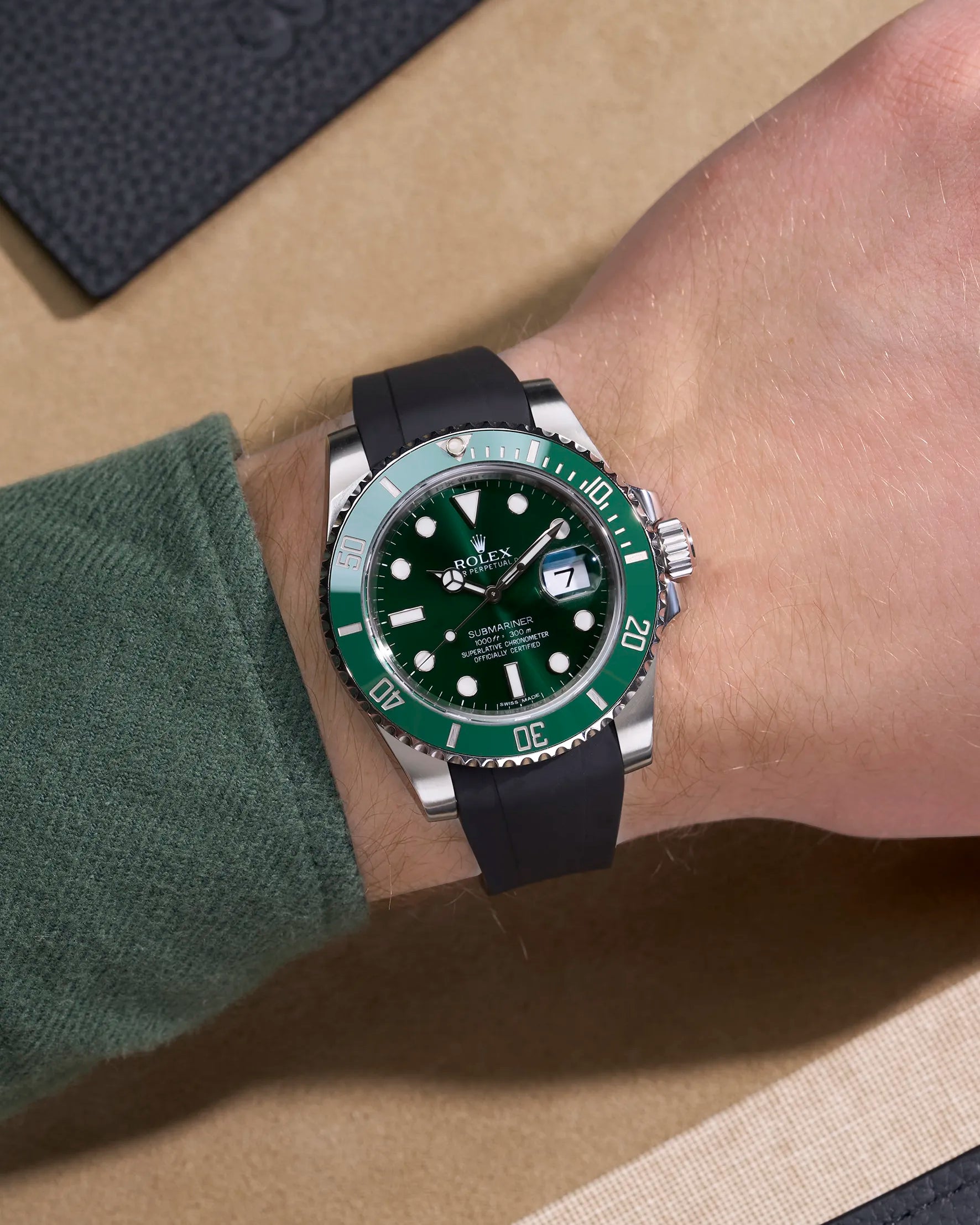 Rolex Submariner 116610LN with black FKM strap and original clasp, worn on wrist