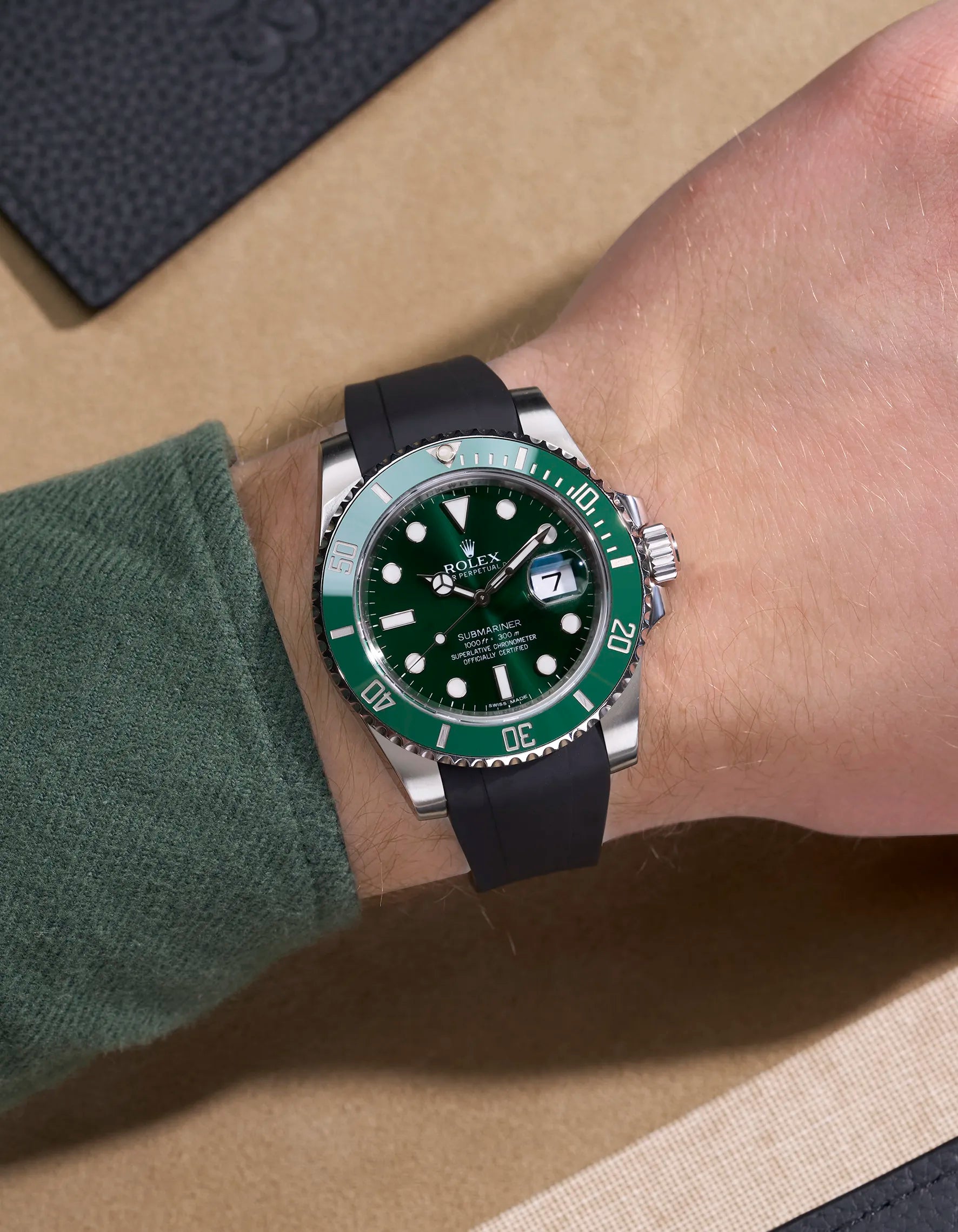 Rolex Submariner 116610LN with black FKM strap and original clasp, worn on wrist