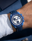 Curved Vertech rubber strap for MoonSwatch with white stitches – photographed on the Super Blue Moonphase