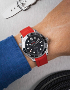 Omega Seamaster 300 Diver with black dial on wrist, paired with red Vertech FKM rubber strap