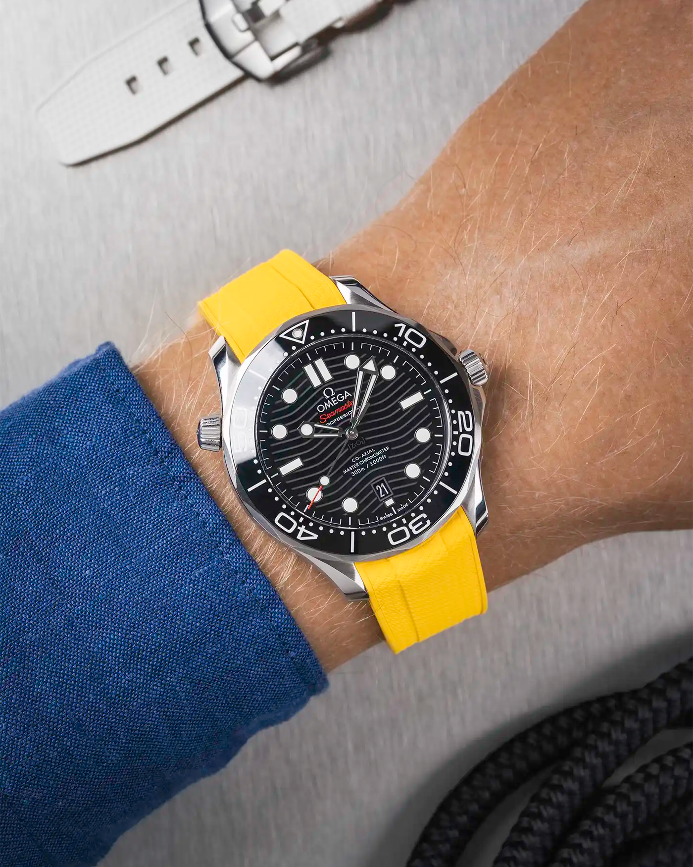 Omega Seamaster 300 Diver with black dial on wrist, paired with yellow Vertech FKM rubber strap