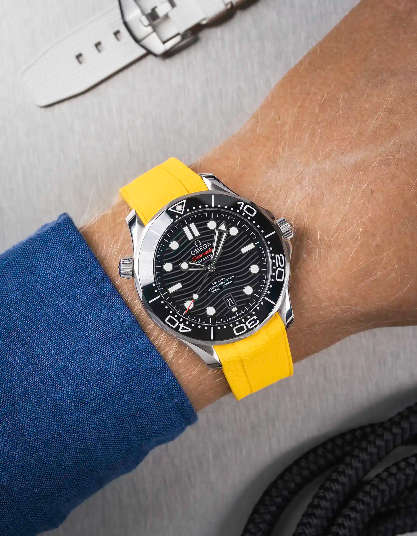 Omega Seamaster 300 Diver with black dial on wrist, paired with yellow Vertech FKM rubber strap