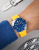 Omega Seamaster 300 Diver with blue dial on wrist, paired with yellow Vertech FKM rubber strap