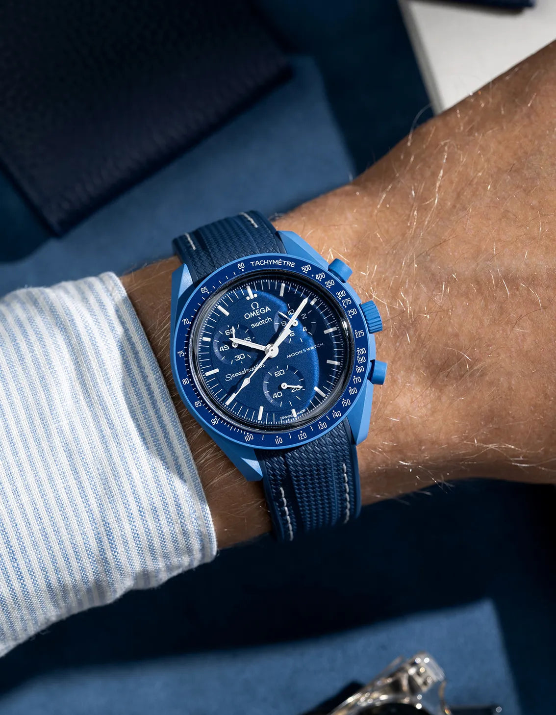 Navy blue rubber strap with white stitching for Omega MoonSwatch, curved Vertech design shown on wrist