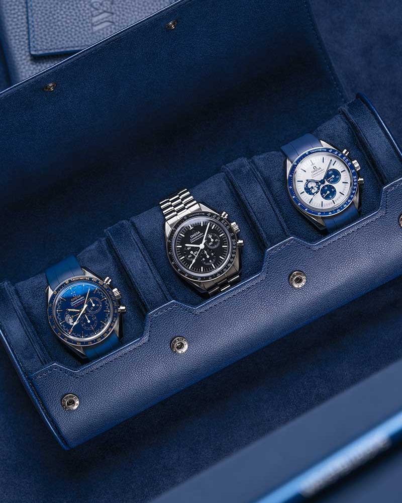 3 Slot Watch Roll in Navy Blue showcasing three luxury watches, highlighting its premium suede interior and secure compartments