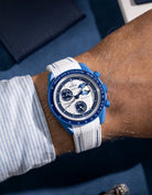 White rubber strap with blue stitches for MoonSwatch, wrist shot on Mission to the Super Blue Moonphase