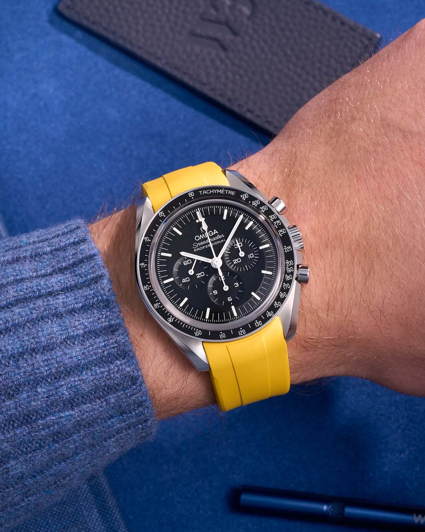 Yellow FKM rubber strap on Omega Speedmaster – wrist shot showing watch on wrist