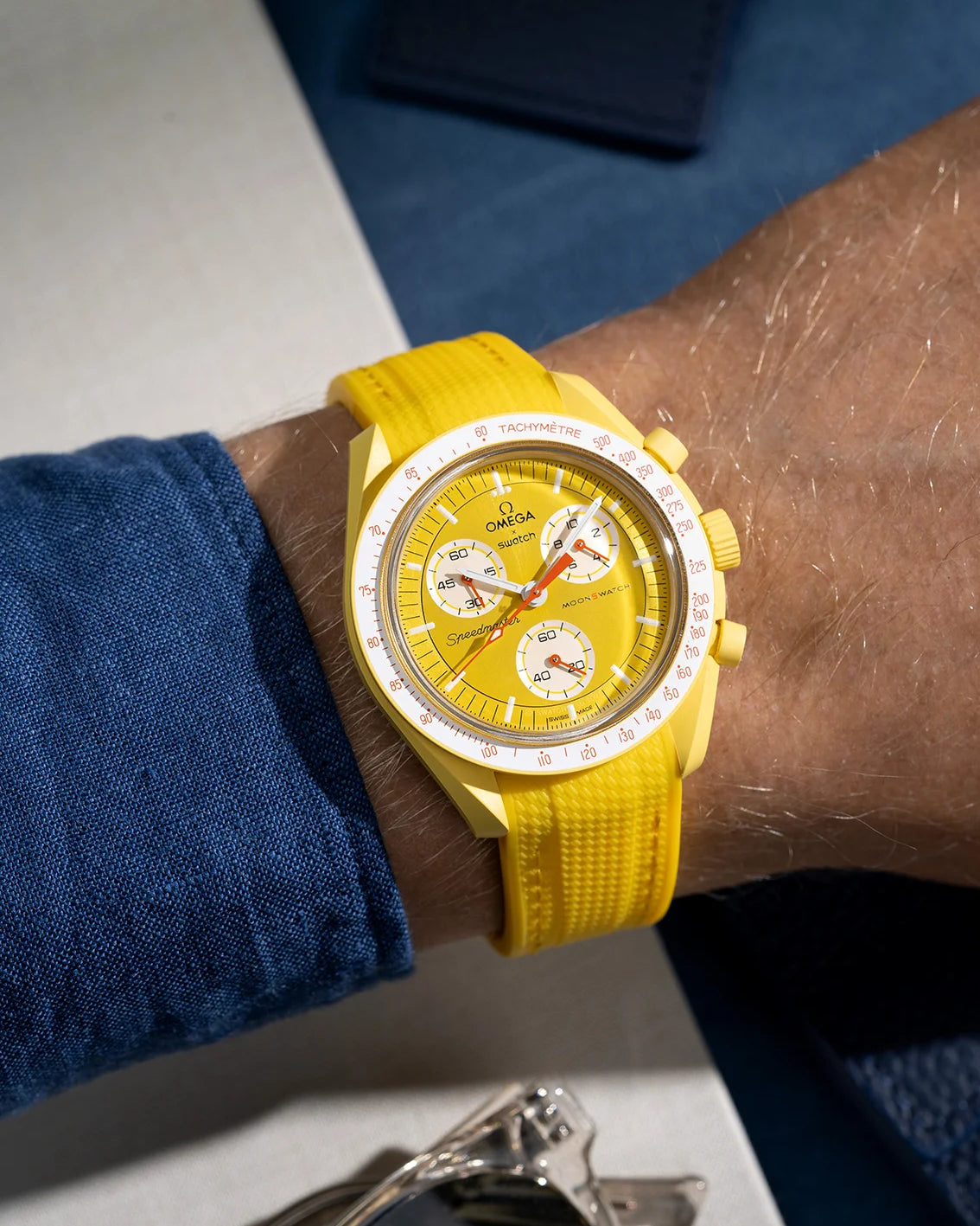 Wrist shot showing yellow vertech rubber strap on Omega X Swatch MoonSwatch Mission to the Sun
