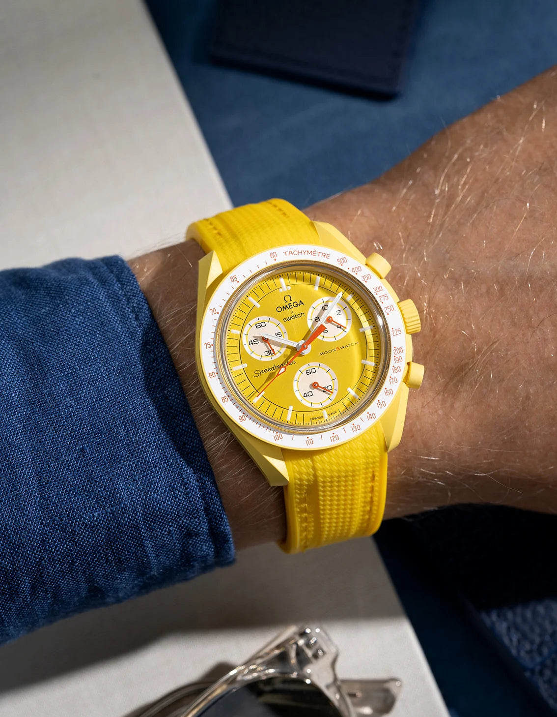 Wrist shot showing yellow vertech rubber strap on Omega X Swatch MoonSwatch Mission to the Sun