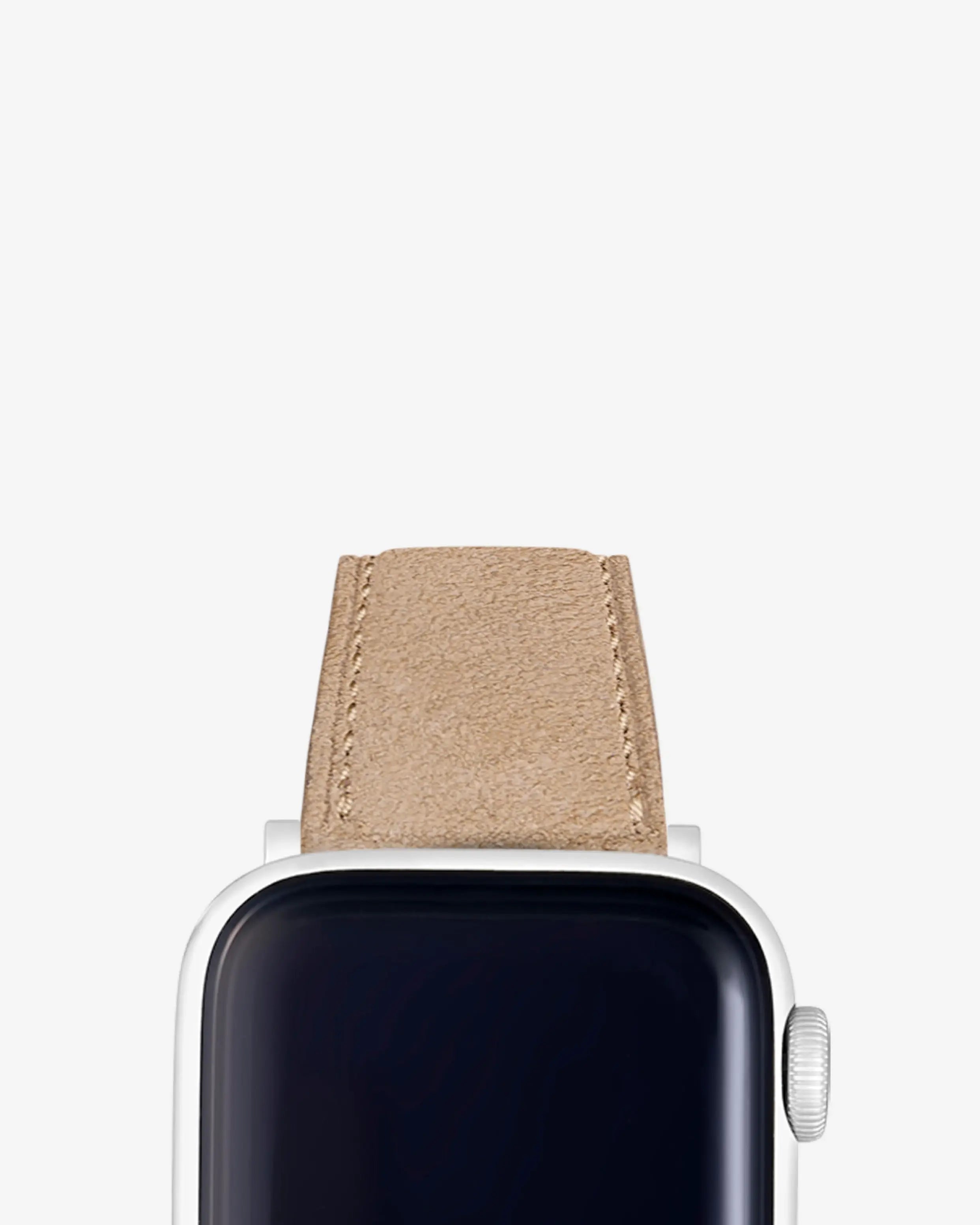 Beige suede Apple Watch strap attached to a silver Apple Watch. Explore our premium bands for Apple Watch – perfect fit for all models.