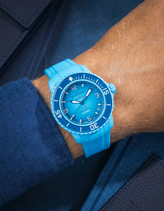 Blue lagoon Rubber Strap on Blancpain X Swatch Blue Lagoon, wrist shot styled with a shirt