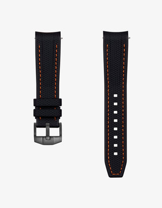 Black vertech rubber watch strap with orange stitching on a white background