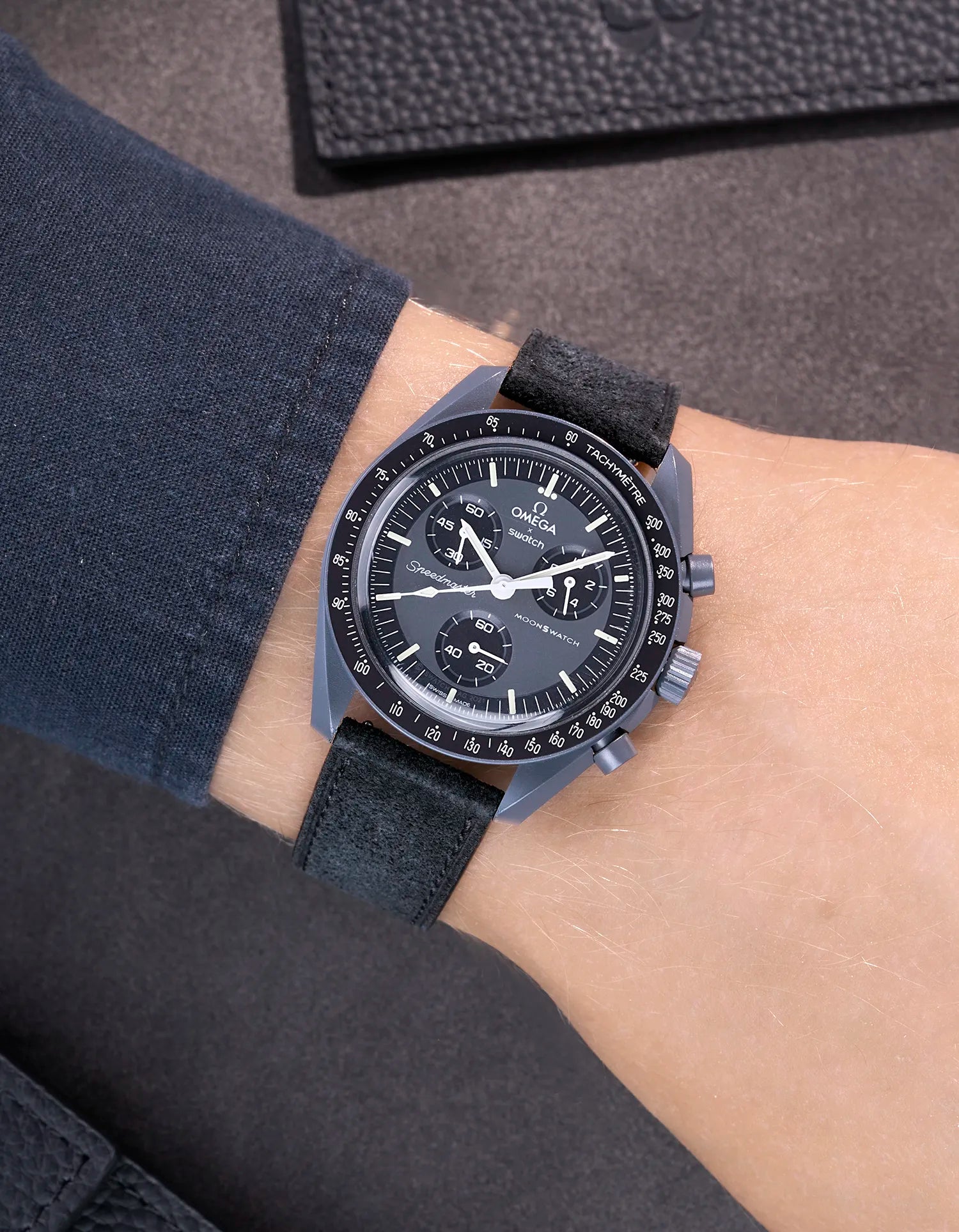 Omega X Swatch Mission to Mercury with Black suede leather strap worn on wrist