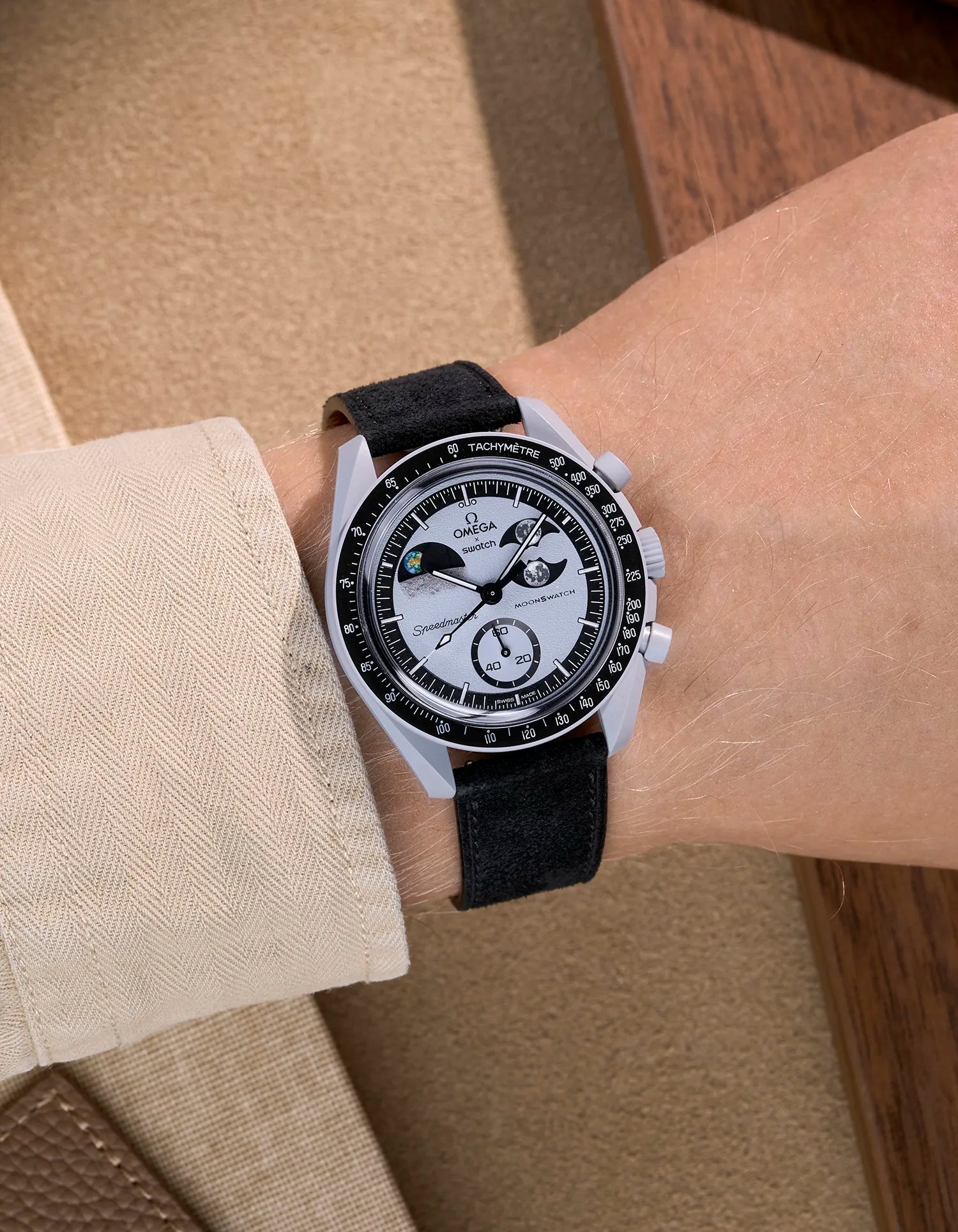 Omega X Swatch Mission to Earthphase with black suede leather strap worn on wrist
