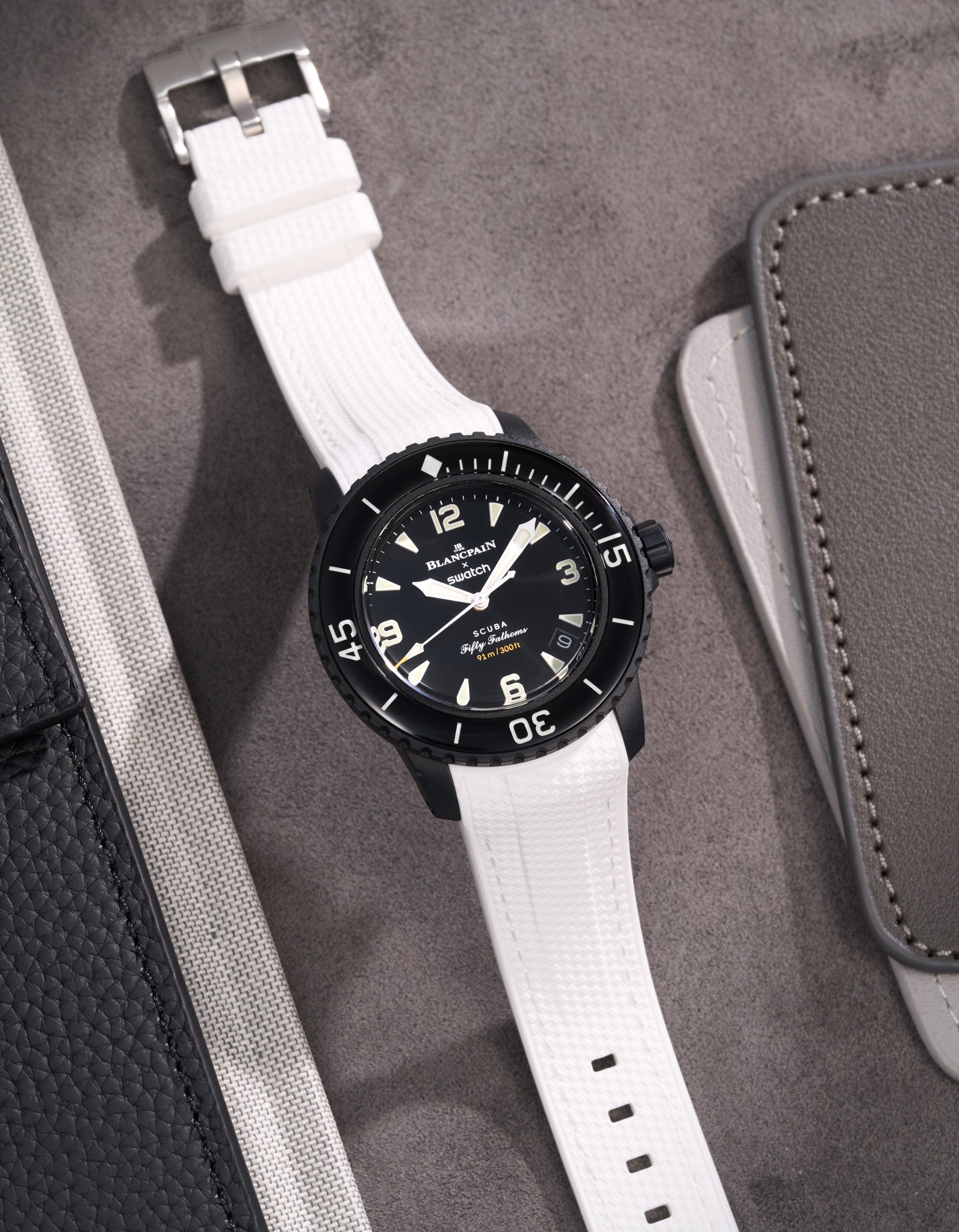 Blancpain X Swatch watch featuring white Vertech rubber strap elegant flat lay product image on grey surface