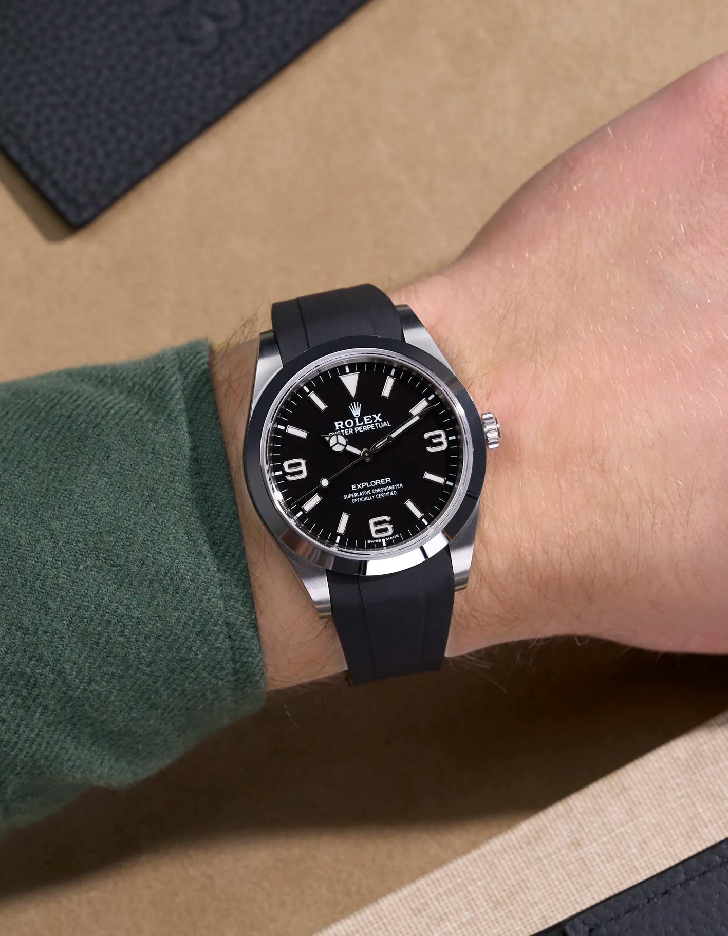 Wrist shot of Rolex Explorer 214270 fitted with black FKM rubber strap and original clasp integration