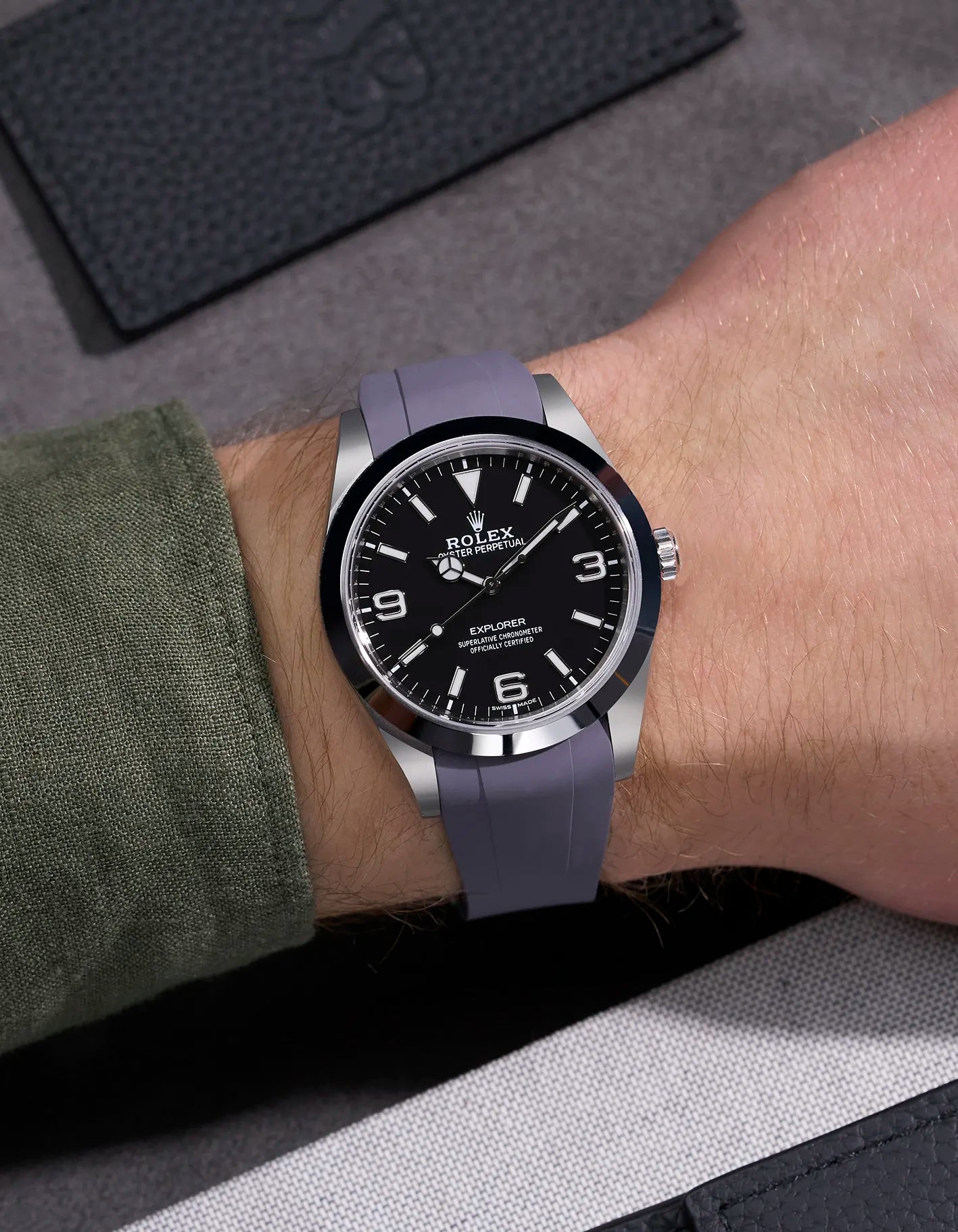 Grey rubber strap with original clasp on Rolex Explorer 214270 – wrist shot showcasing seamless fit