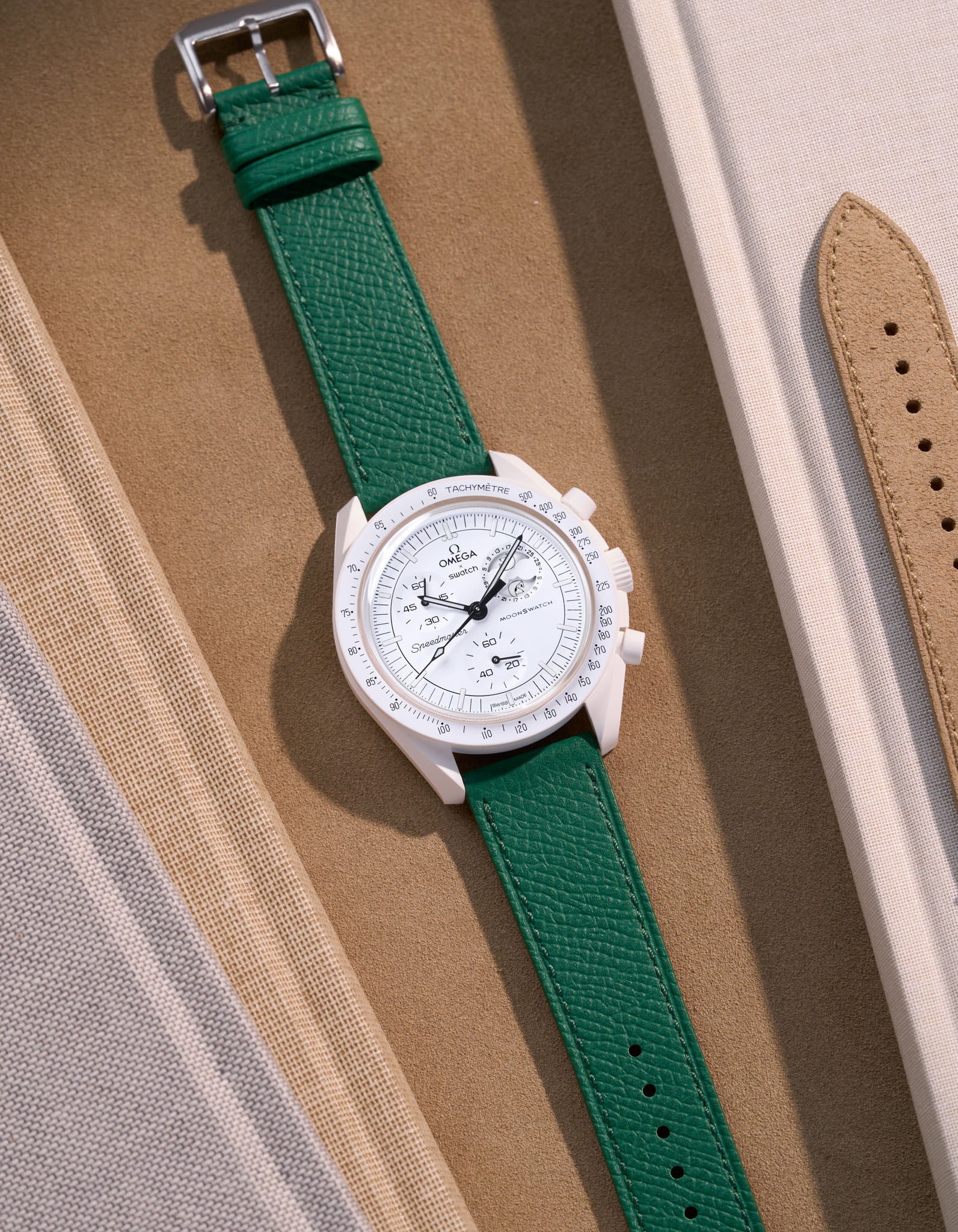 Flat lay of Green Epsom leather strap for Omega x Swatch MoonSwatch Mission to the Moonphase Full Moon