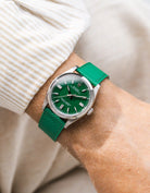 Green Epsom leather straps on Rolex OP wrist shot with beige shirt