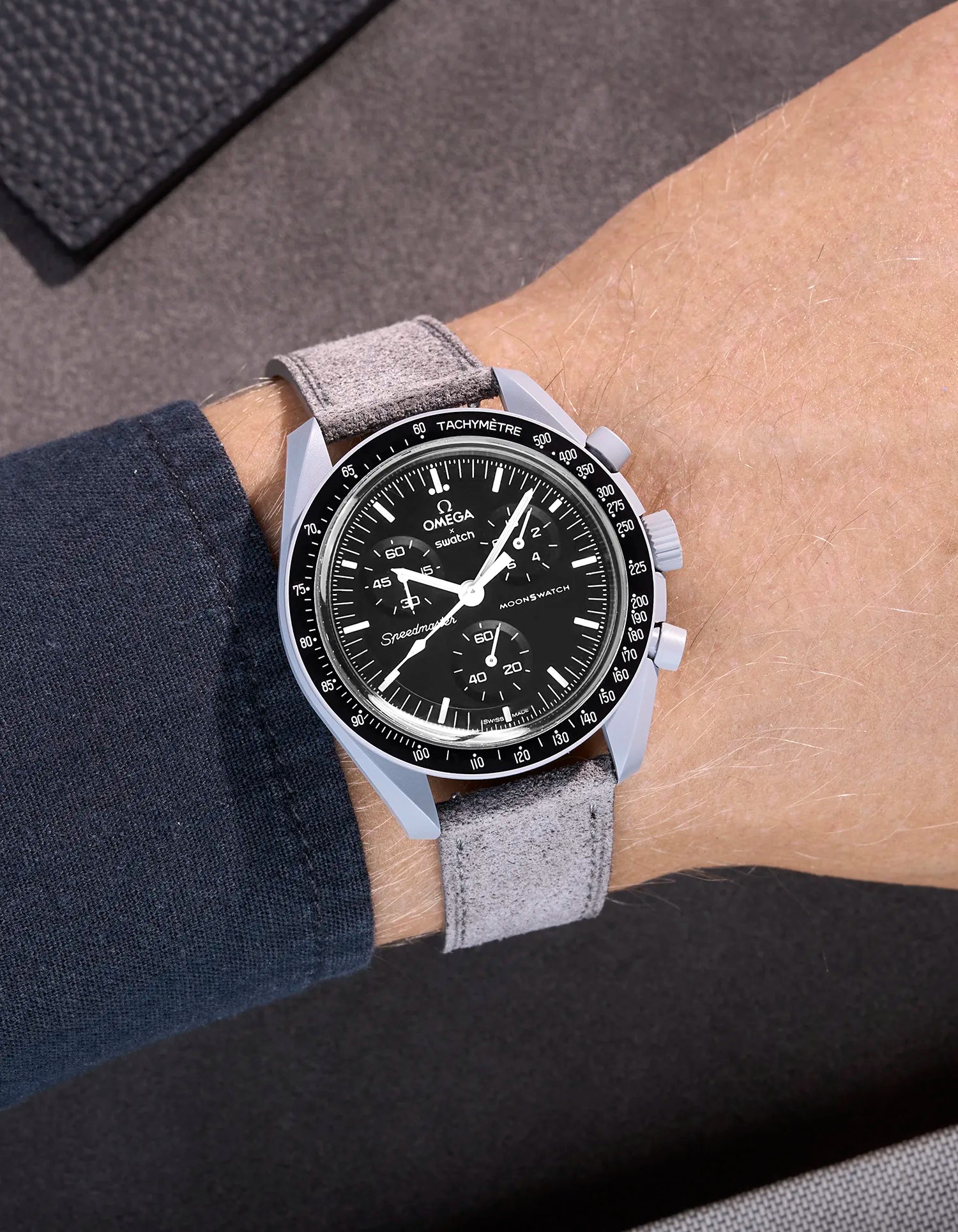 Omega X Swatch Mission to the Moon with grey suede leather strap worn on wrist