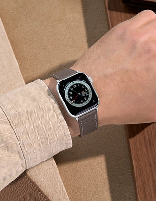 Grey Epsom Leather Apple Watch Band on wrist with beige background