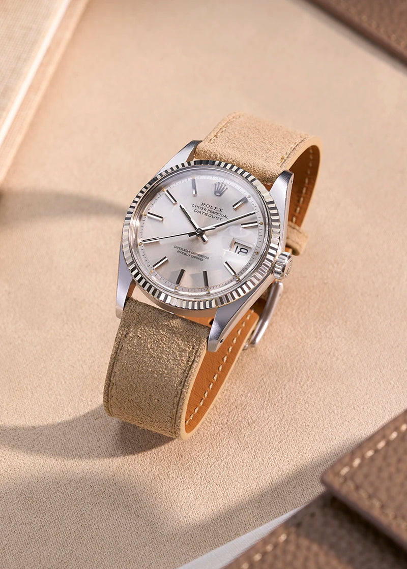 Rolex Datejust with a beige suede leather strap on a light background, showcasing Wristbuddys refined craftsmanship and timeless design.