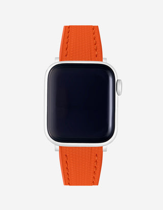 Flexible Orange rubber Apple Watch band on watch – durable and sweat-resistant