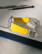Yellow textured FKM rubber watch band for Rolex Explorer II 16570, premium custom integrated fit for original clasp, shown on a white valet tray.